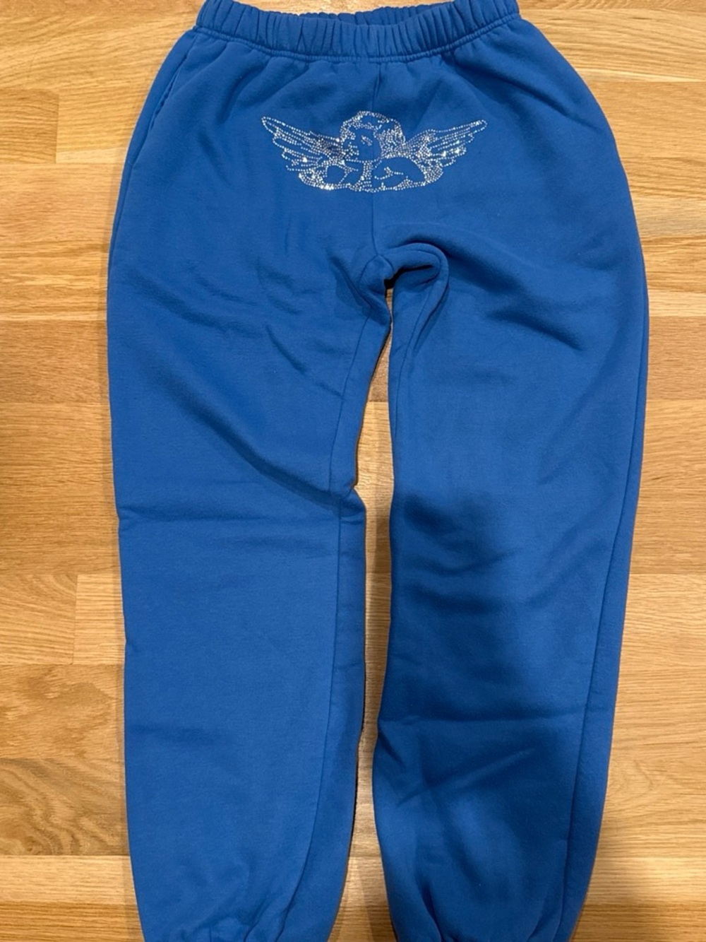 Blue sweatpants with bedazzled angel